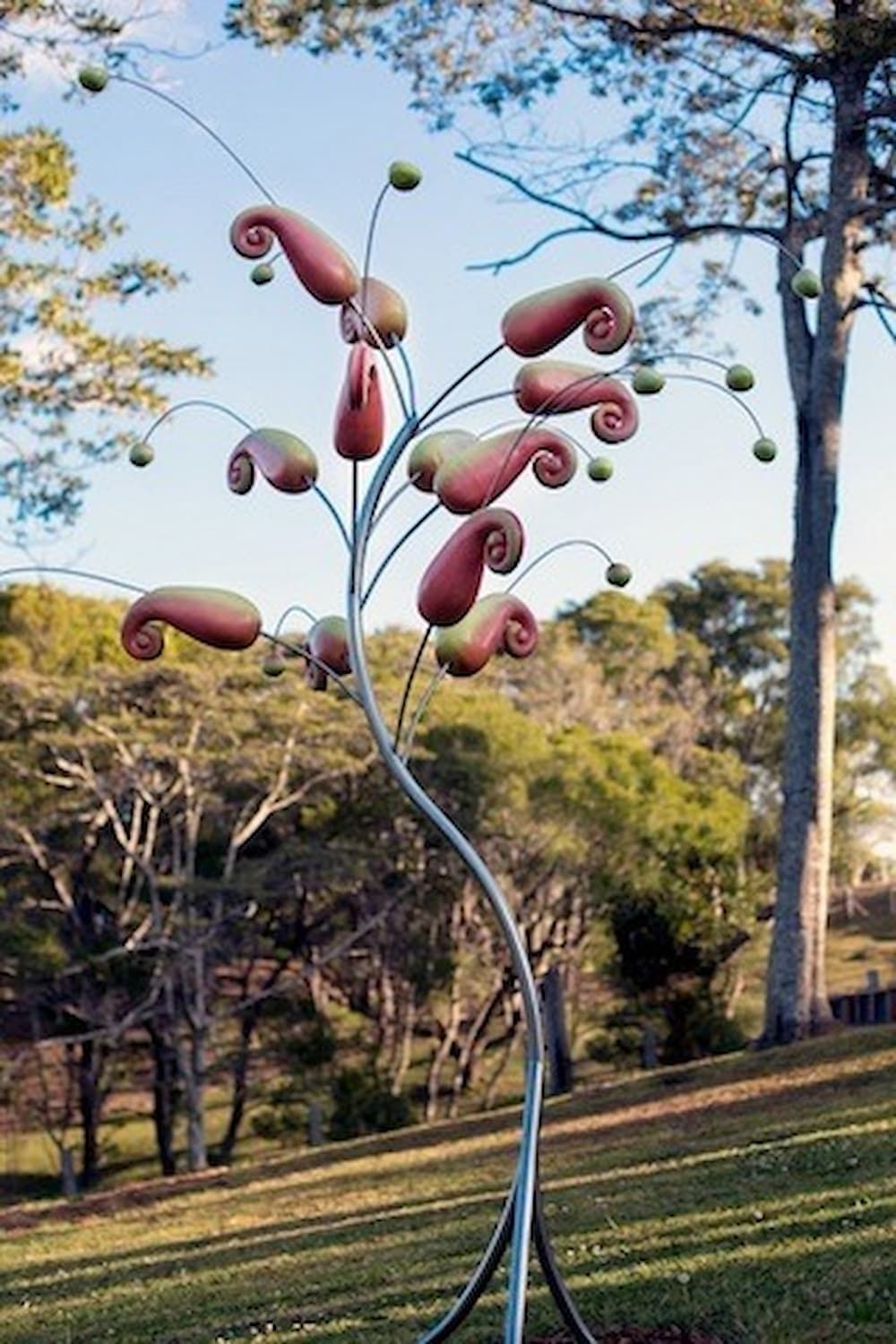 A Sculpture of a Tree With Flowers on It in a Park — Metaltrendz in Kunda Park, QLD