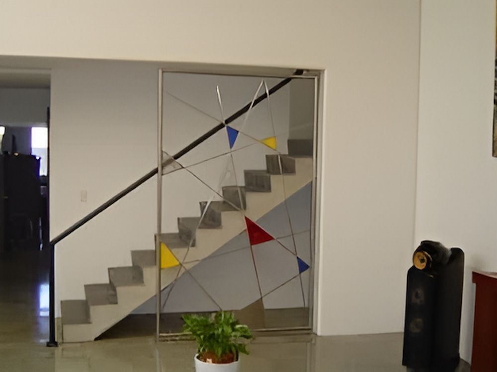 A Staircase With a Stained Glass Window Behind It — Metaltrendz in Kunda Park, QLD