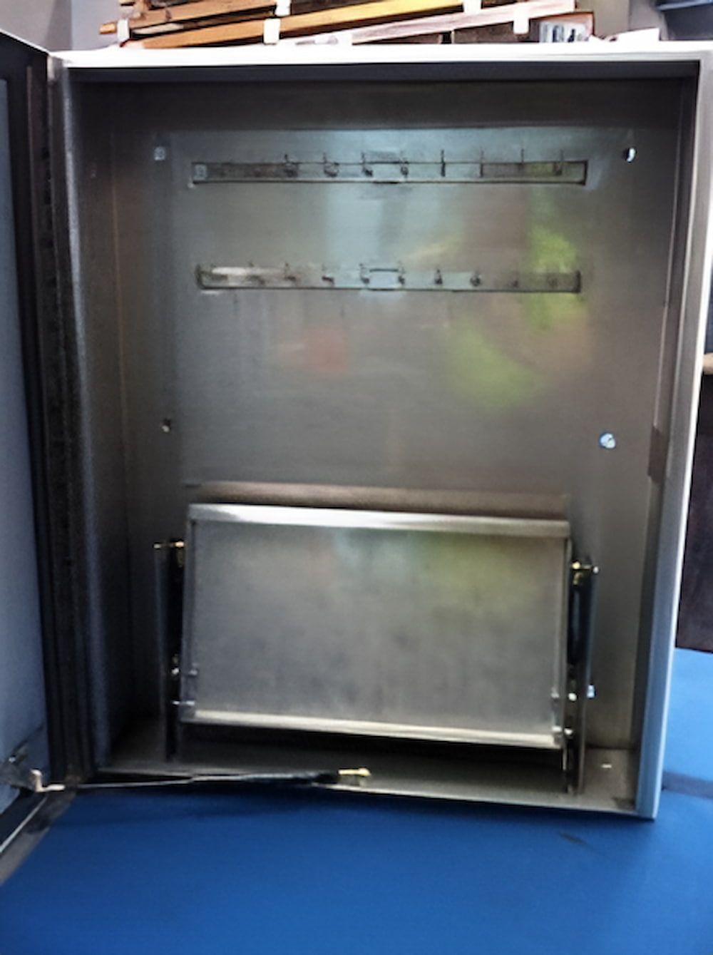 A Stainless Steel Box With the Door Open on a Blue Table — Metaltrendz in Kunda Park, QLD