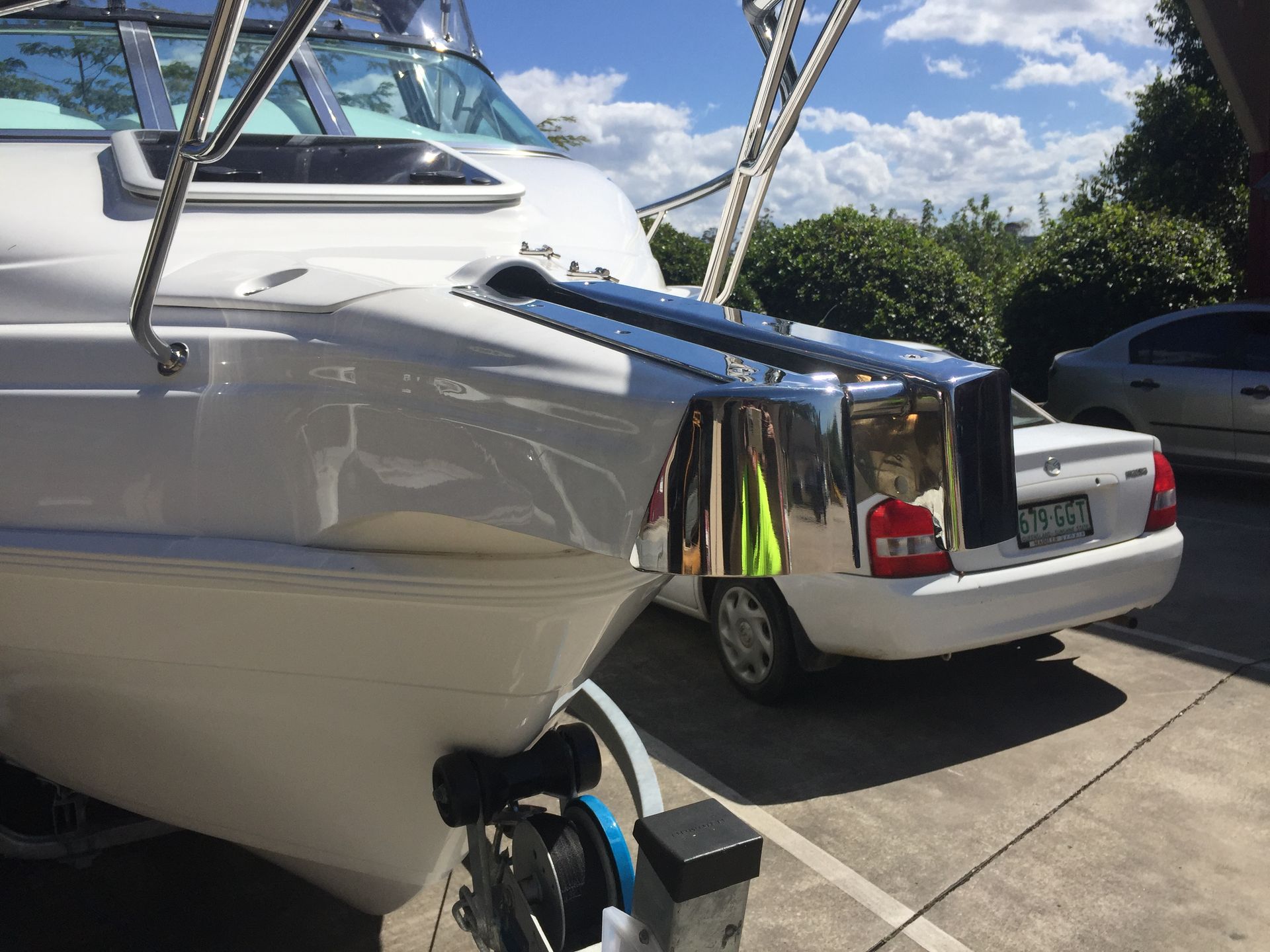 A White Boat is Parked Next to a White Car in a Parking Lot — Metaltrendz in Kunda Park, QLD