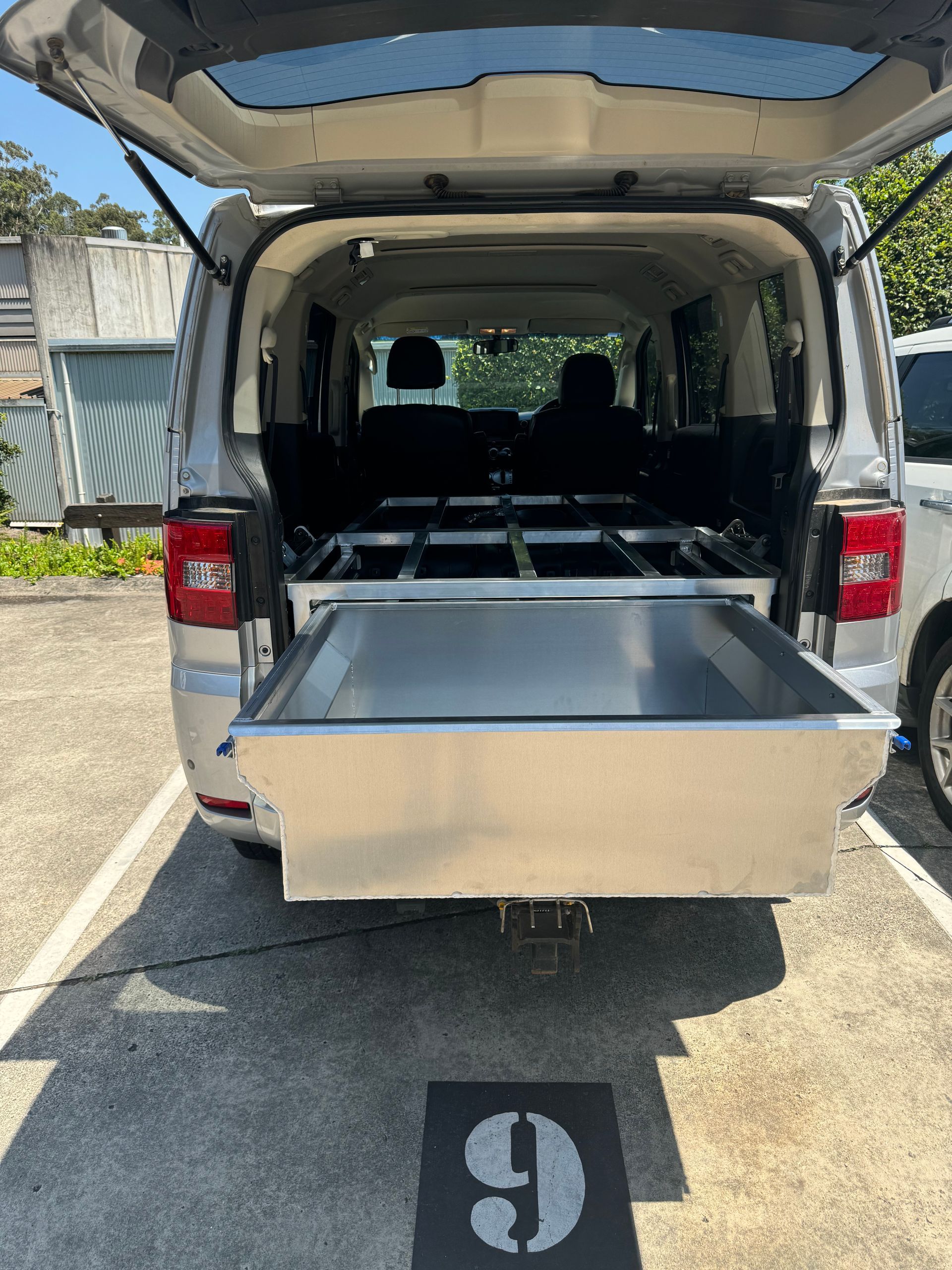 Silver van with open back, containing a metal tray — Metaltrendz in Kunda Park, QLD