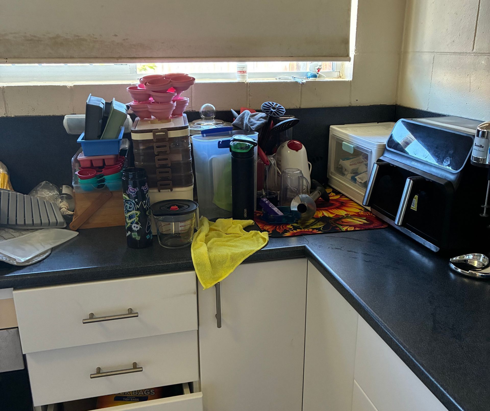 Cluttered Kitchen Counter With Various Containers, Appliances — Schmucker Cleaning in Gulliver, QLD