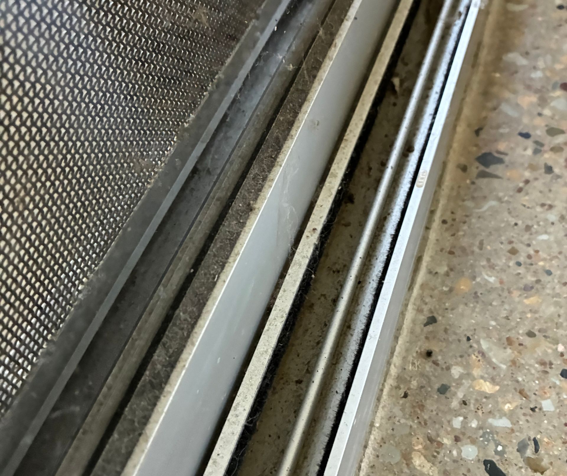 Hand Holding a Dusty, White Fiber, With White Window Blinds in the Background — Schmucker Cleaning in Gulliver, QLD