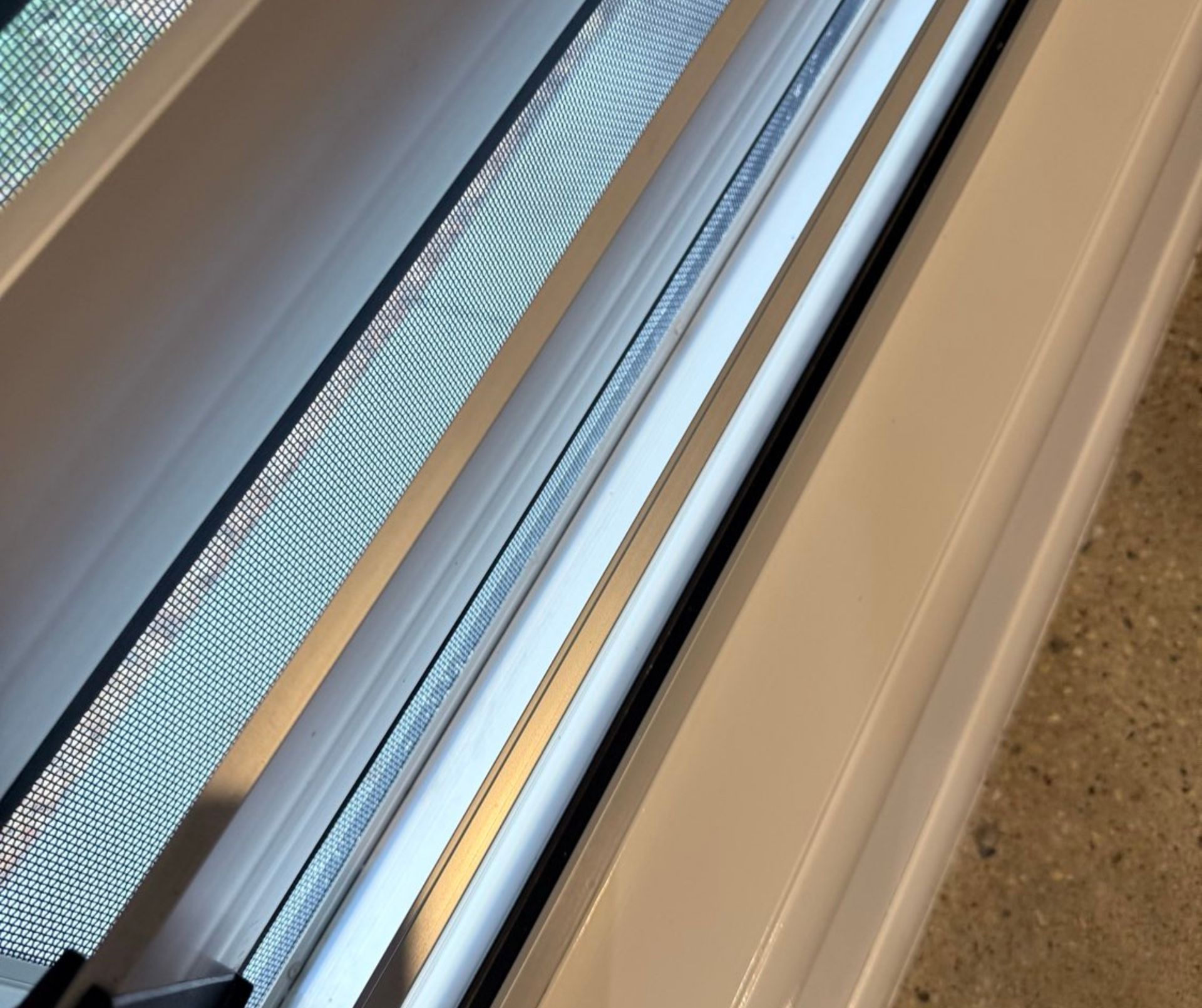 White Interior Shutters Partially Open, Showing Outside View — Schmucker Cleaning in Gulliver, QLD