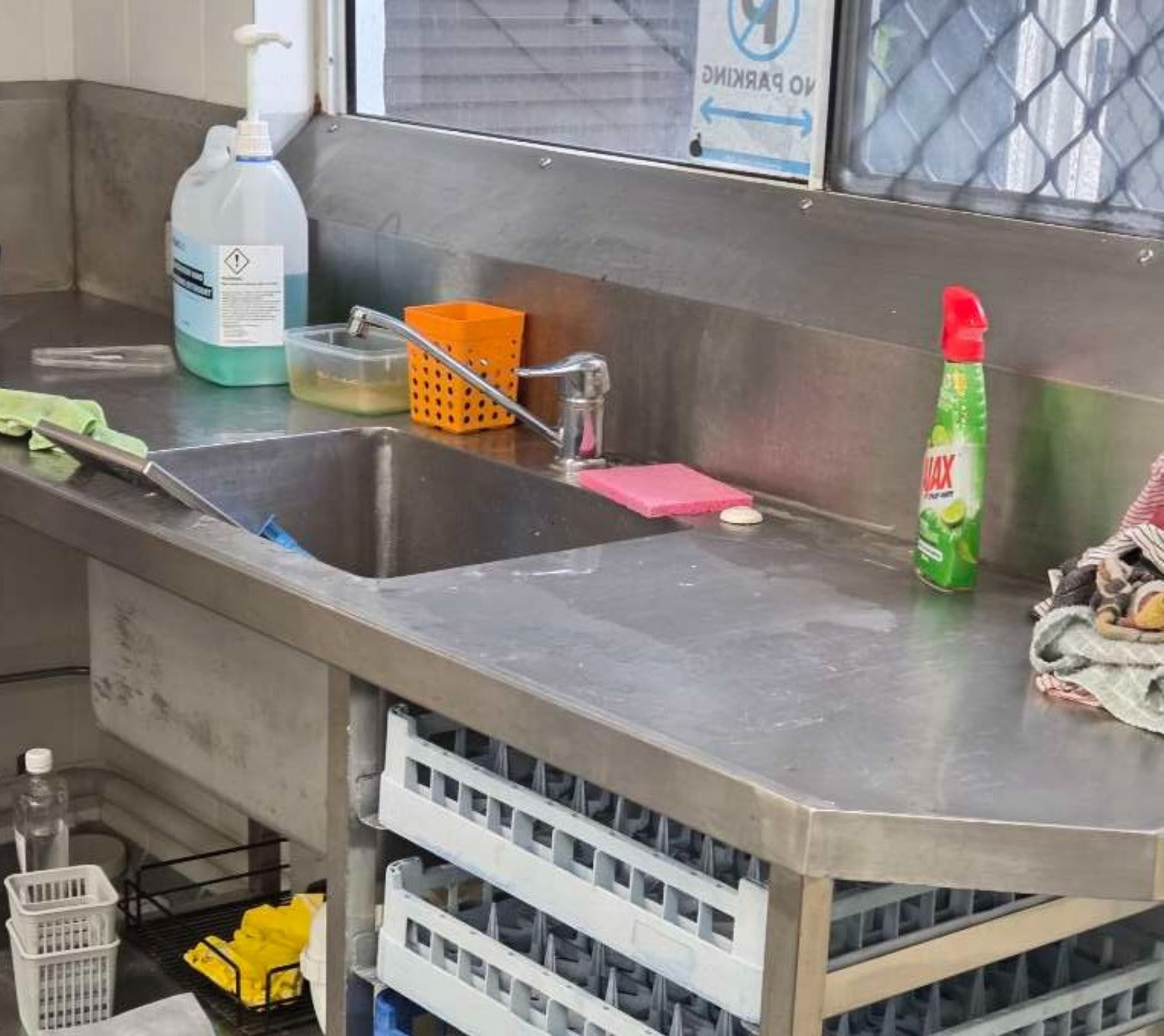 Dirty Stainless steel benchtop with sink— Schmucker Cleaning in Gulliver, QLD