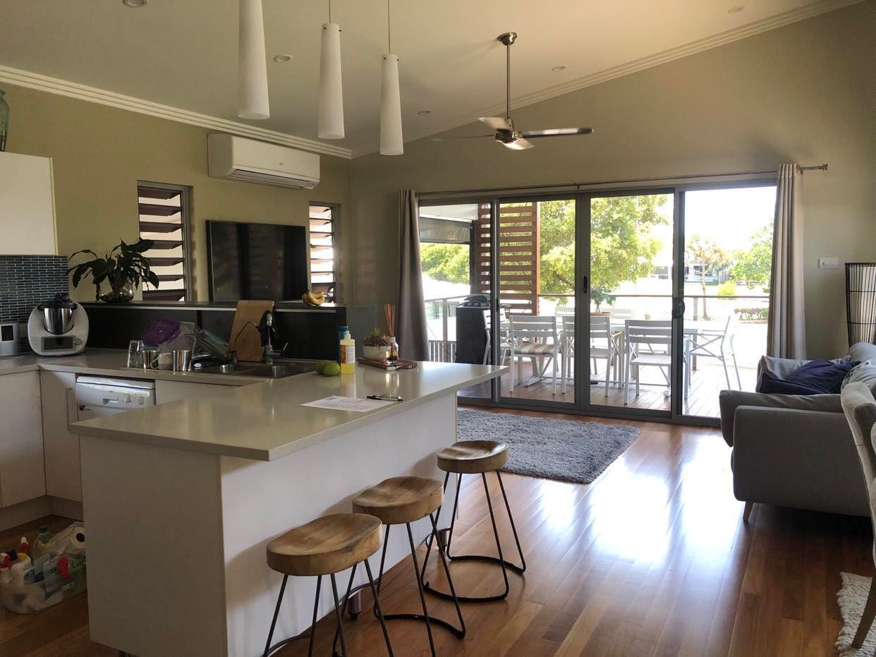 Open-plan Kitchen and Living Room With Island — Schmucker Cleaning in Gulliver, QLD