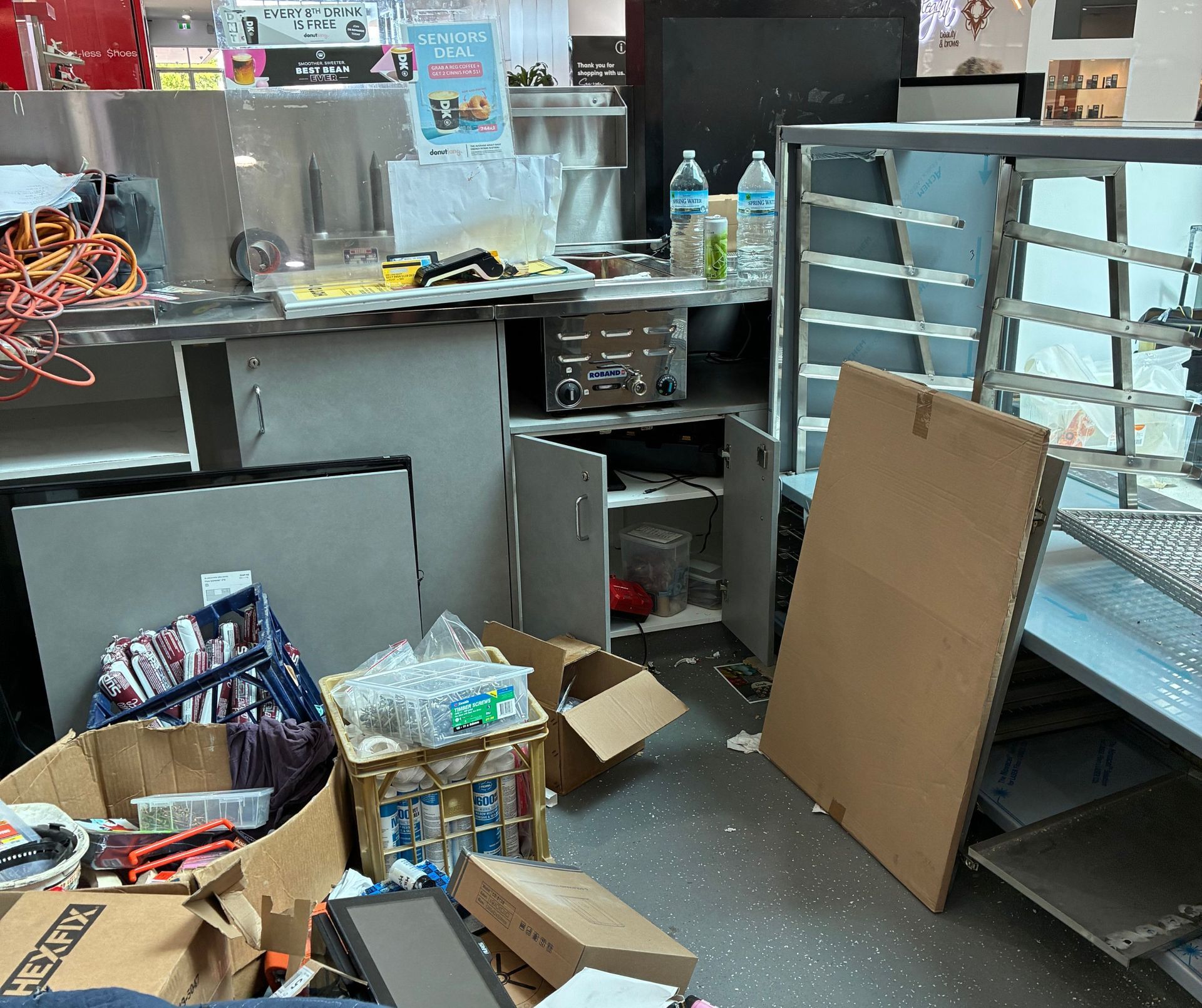 A Cluttered Commercial Kitchen During Construction With Stainless Steel — Schmucker Cleaning in Gulliver, QLD