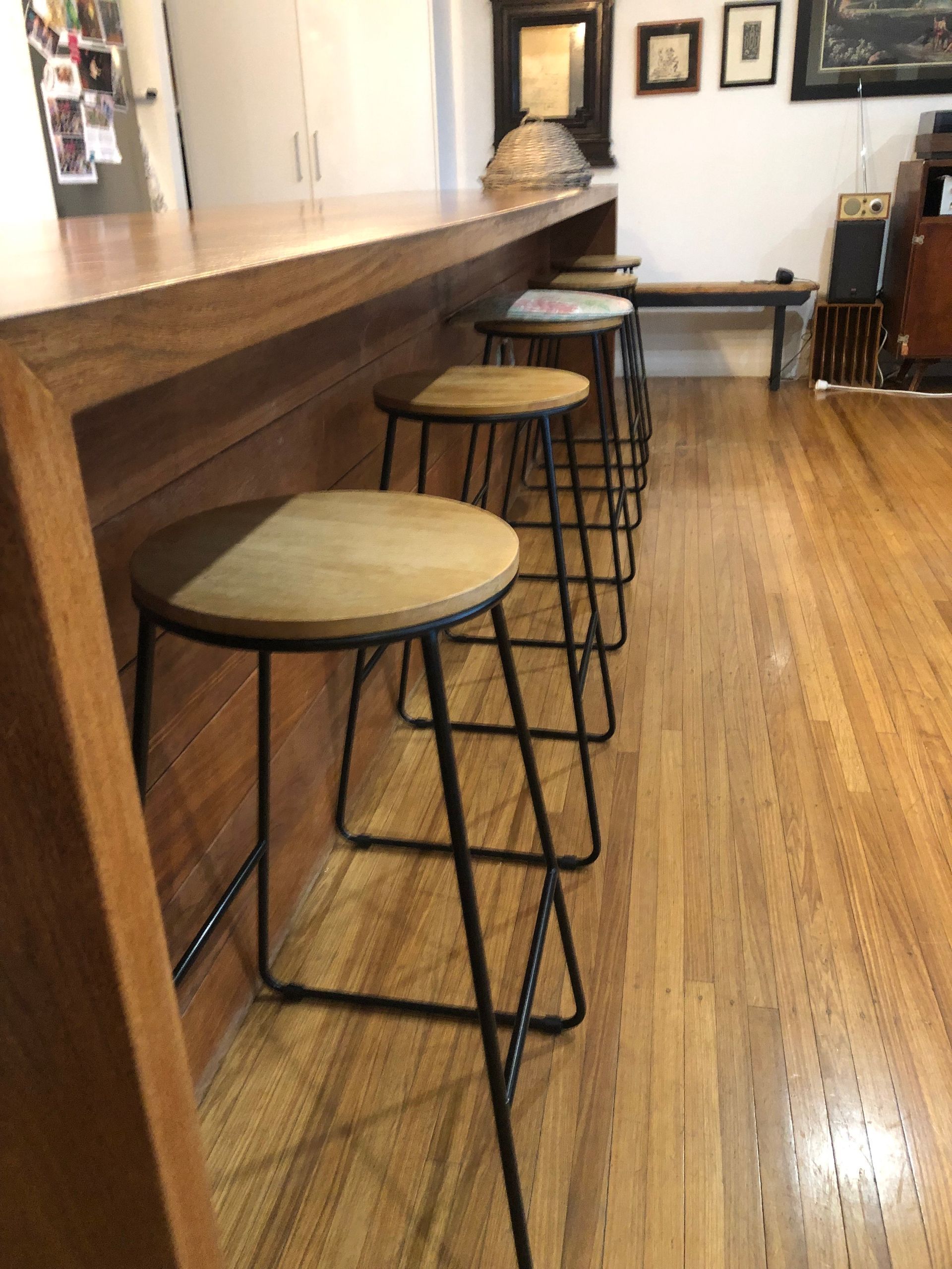 A Row Of Bar Stools In A Kitchen — Schmucker Cleaning in Gulliver, QLD