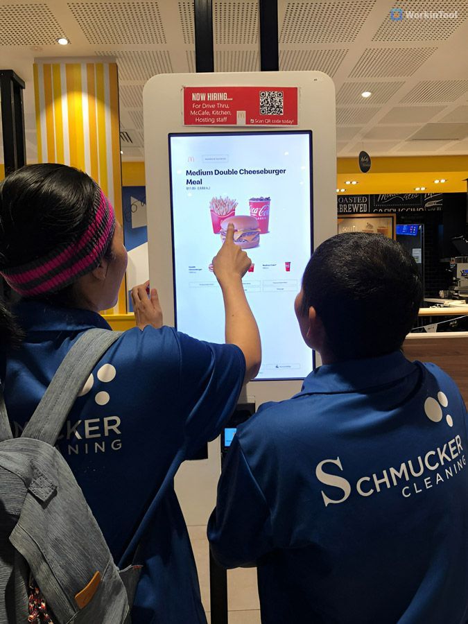 Mother and Child Are Using a Kiosk — Schmucker Cleaning in Gulliver, QLD