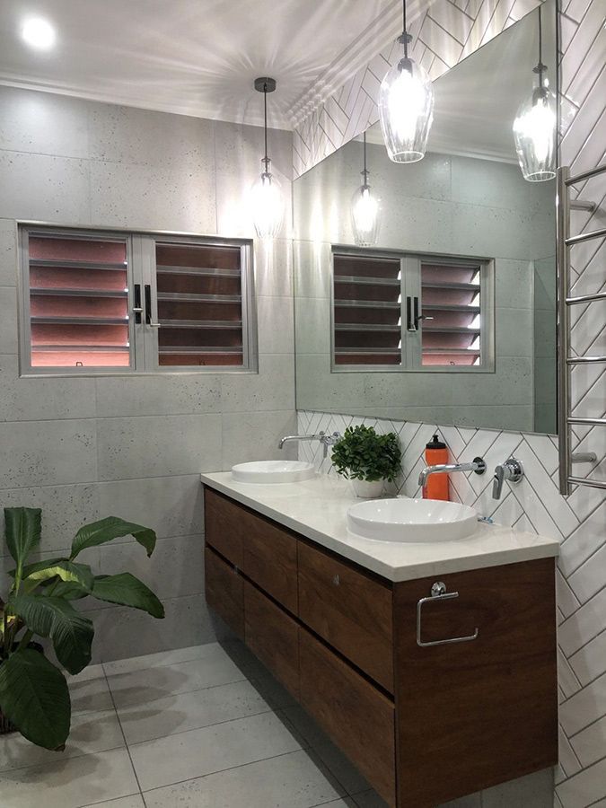 A Bathroom With Two Sinks and a Large Mirror — Schmucker Cleaning in Gulliver, QLD
