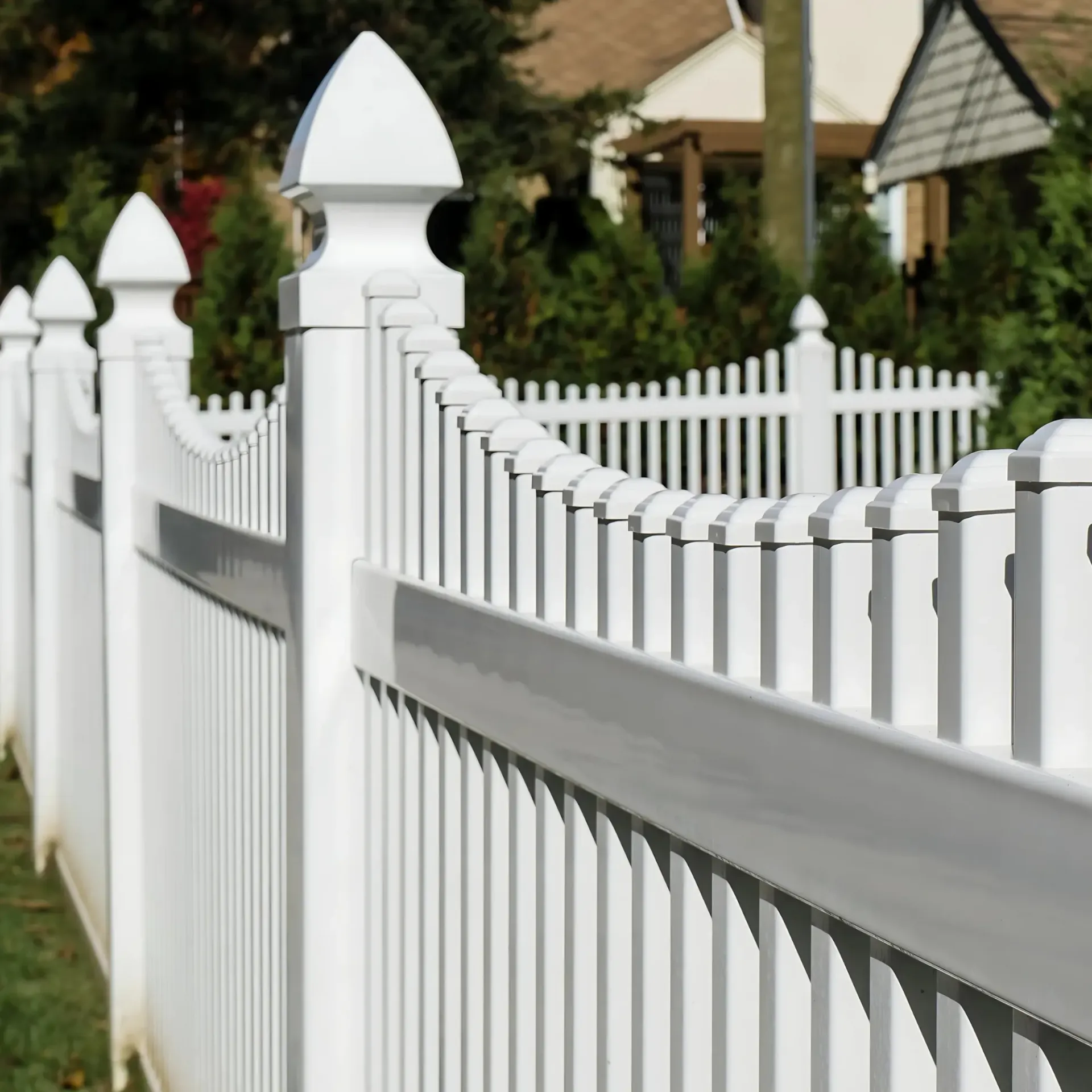 Boots & Boards Fencing - A white picket fence with a house in the background