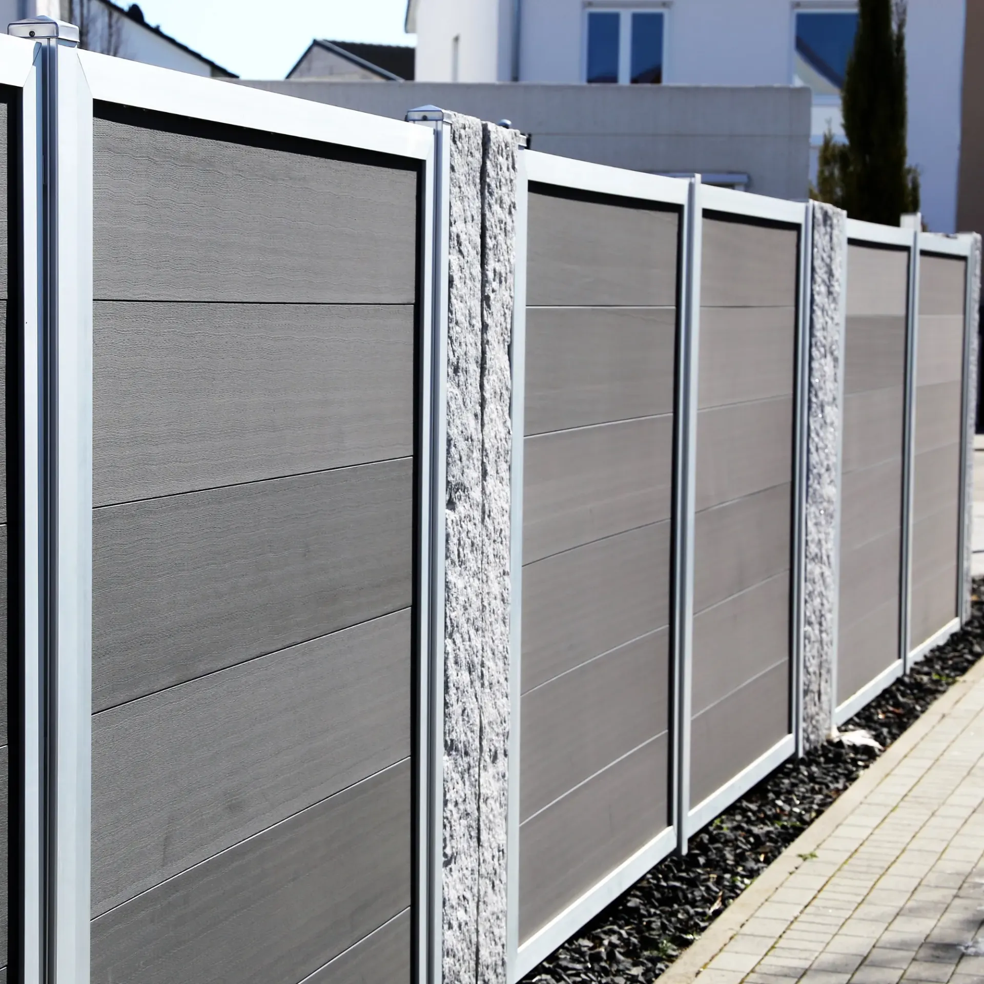 Boots & Boards Fencing - A row of fences along a sidewalk in front of a house