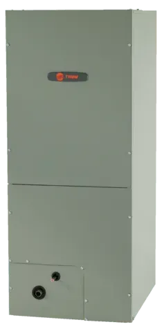 A gray Trane brand HVAC unit. Tall, rectangular, with visible screws and a black pipe on the lower section.