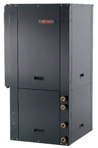 Black HVAC unit with brass-colored pipes, indoors.