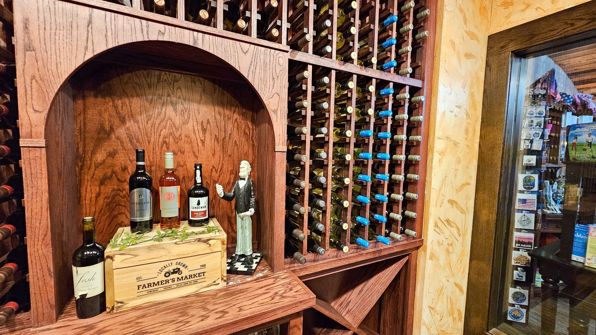 A wine cellar filled with lots of bottles of wine.