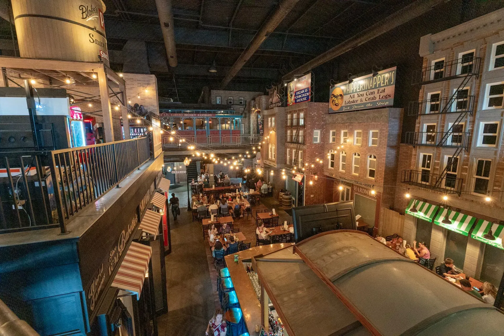 An aerial view of a restaurant with people sitting at tables.