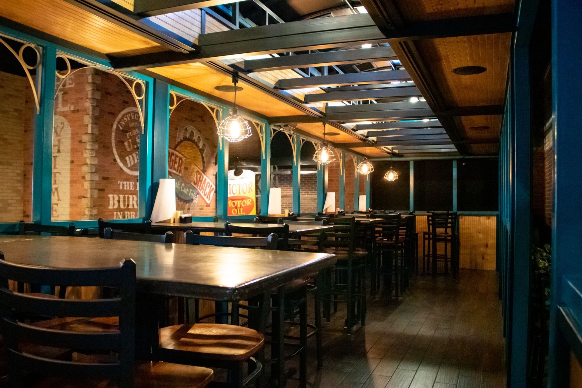 A restaurant with a lot of tables and chairs