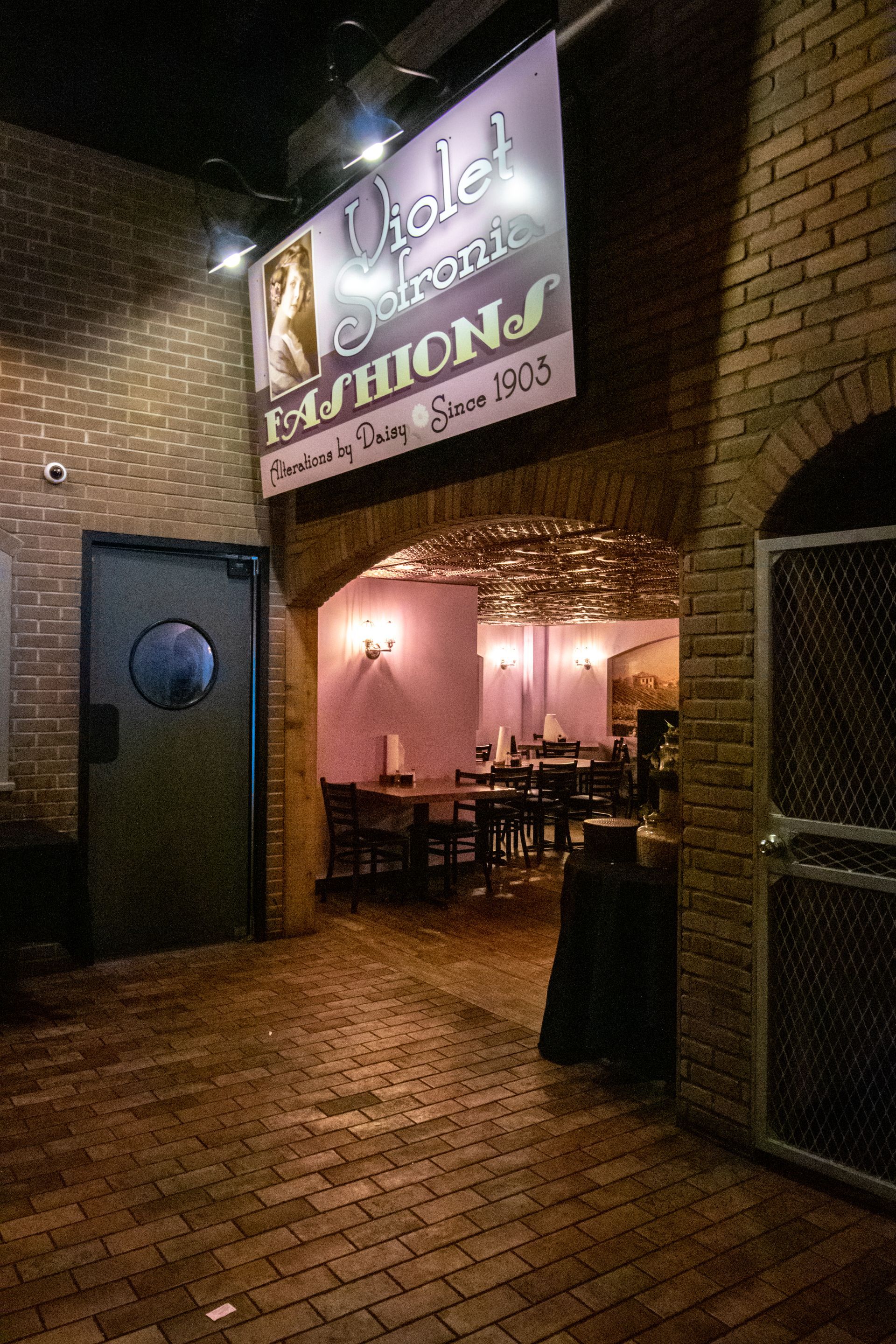 A brick building with a sign that says ' violet ' on it