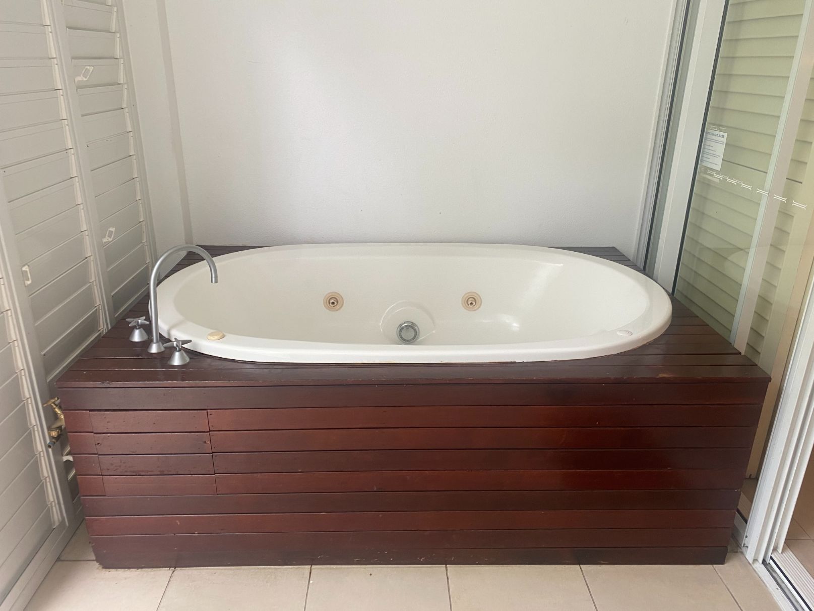 A Bathtub with Timber Frames — Painting & Maintenance FNQ Handyman Service in Clifton Beach, QLD