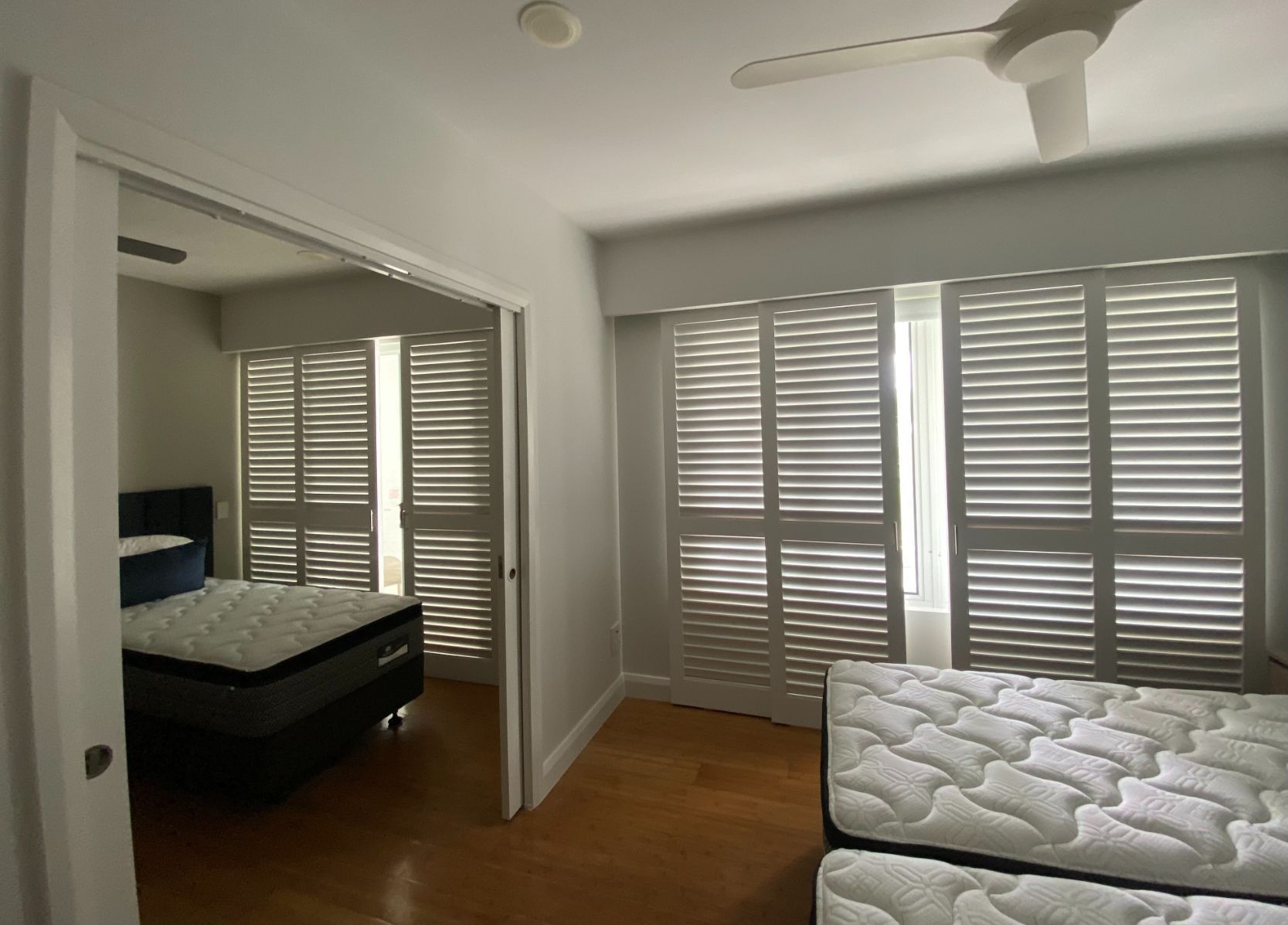 A Freshly Painted Bedroom with Blinds — Painting & Maintenance FNQ Handyman Service in Clifton Beach, QLD