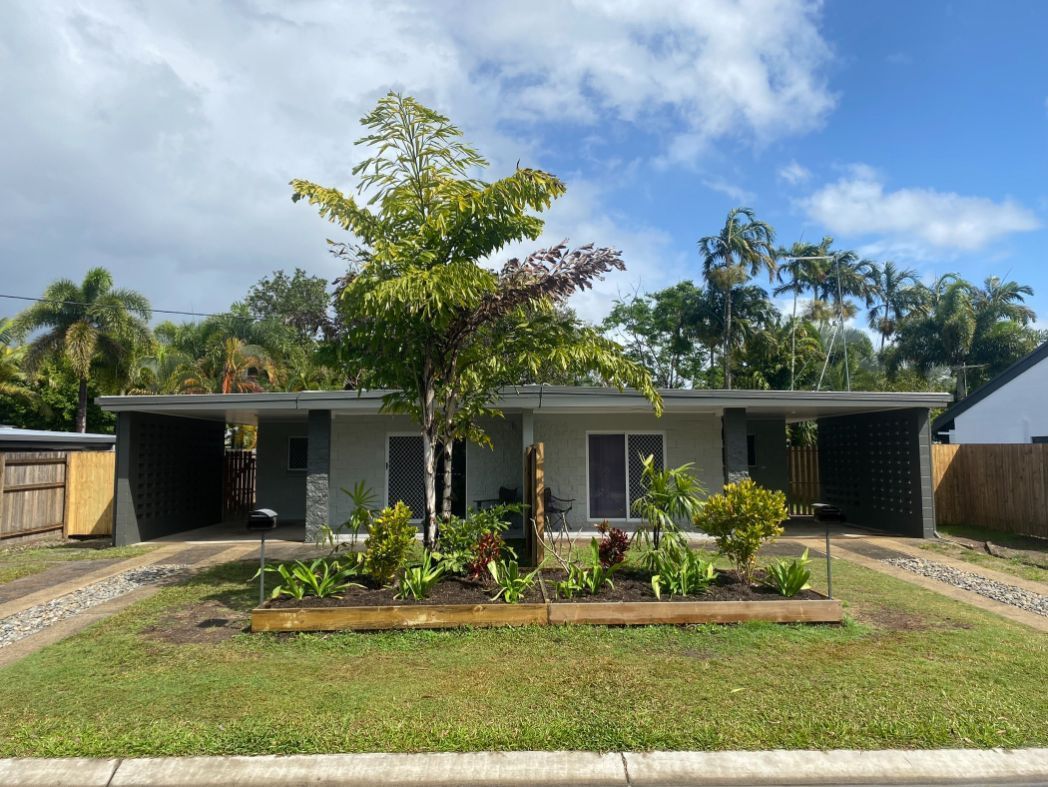A House With a Lot of Grass and Trees in Front of It — Painting & Maintenance FNQ Handyman Service in Clifton Beach, QLD