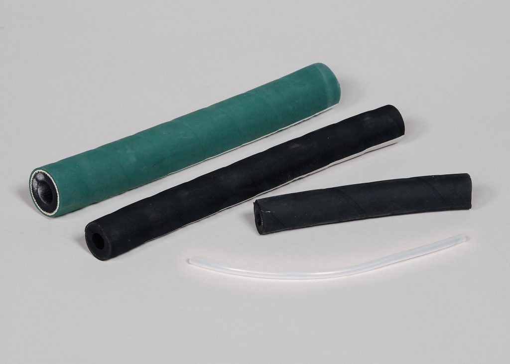 Three flexible ribbed tubes in green, black, and clear on a white background