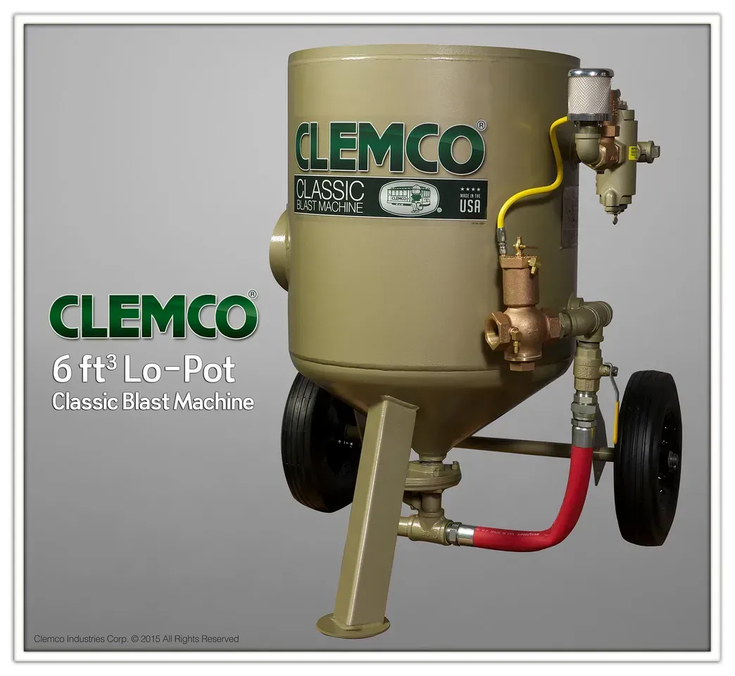 CLEMCO 6 ft³ Lo-Posit blast machine, beige tank with wheels, hoses, and valves on a gray background
