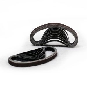 Two black looped elastic bands stacked on a white background