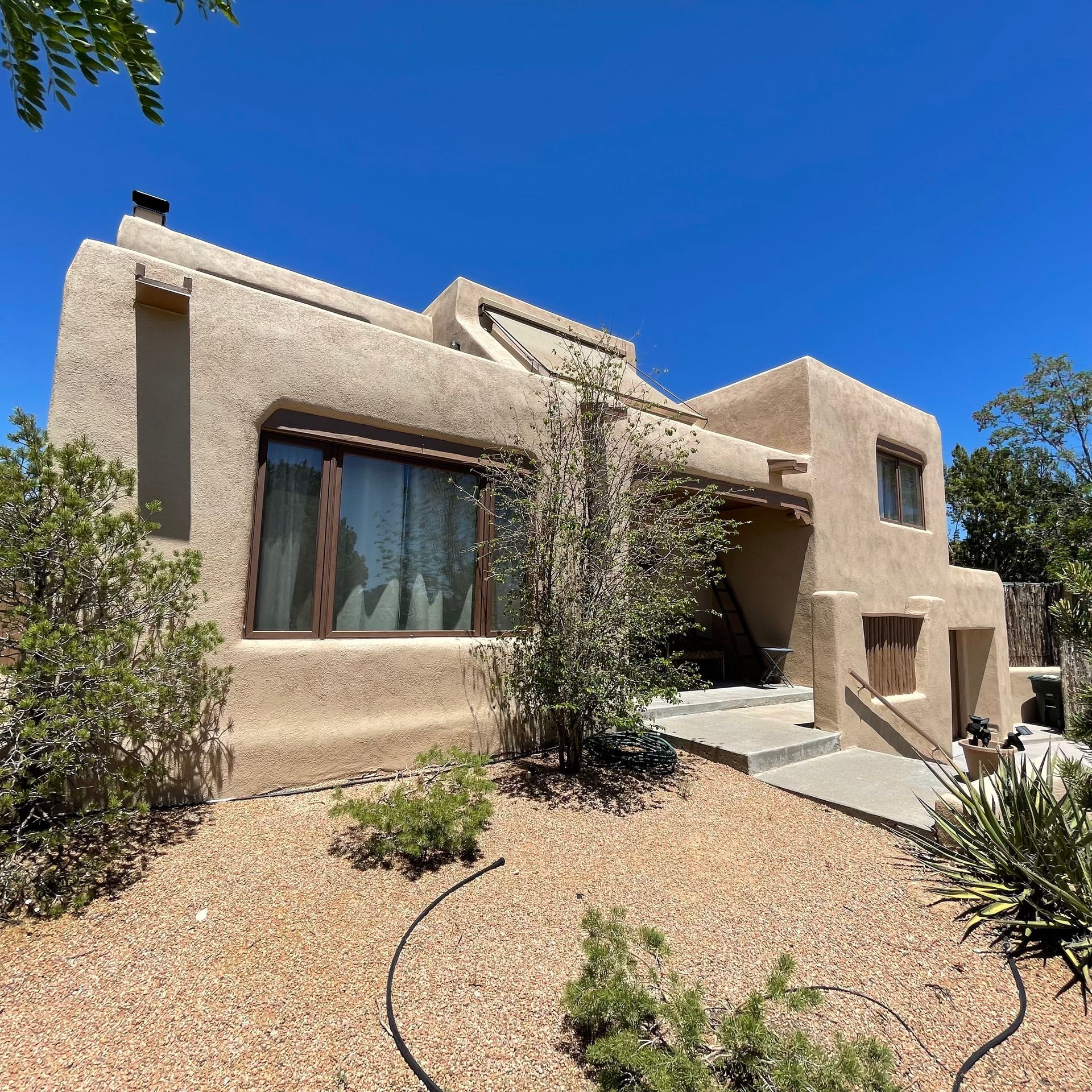 a large house with a blue sky in the background