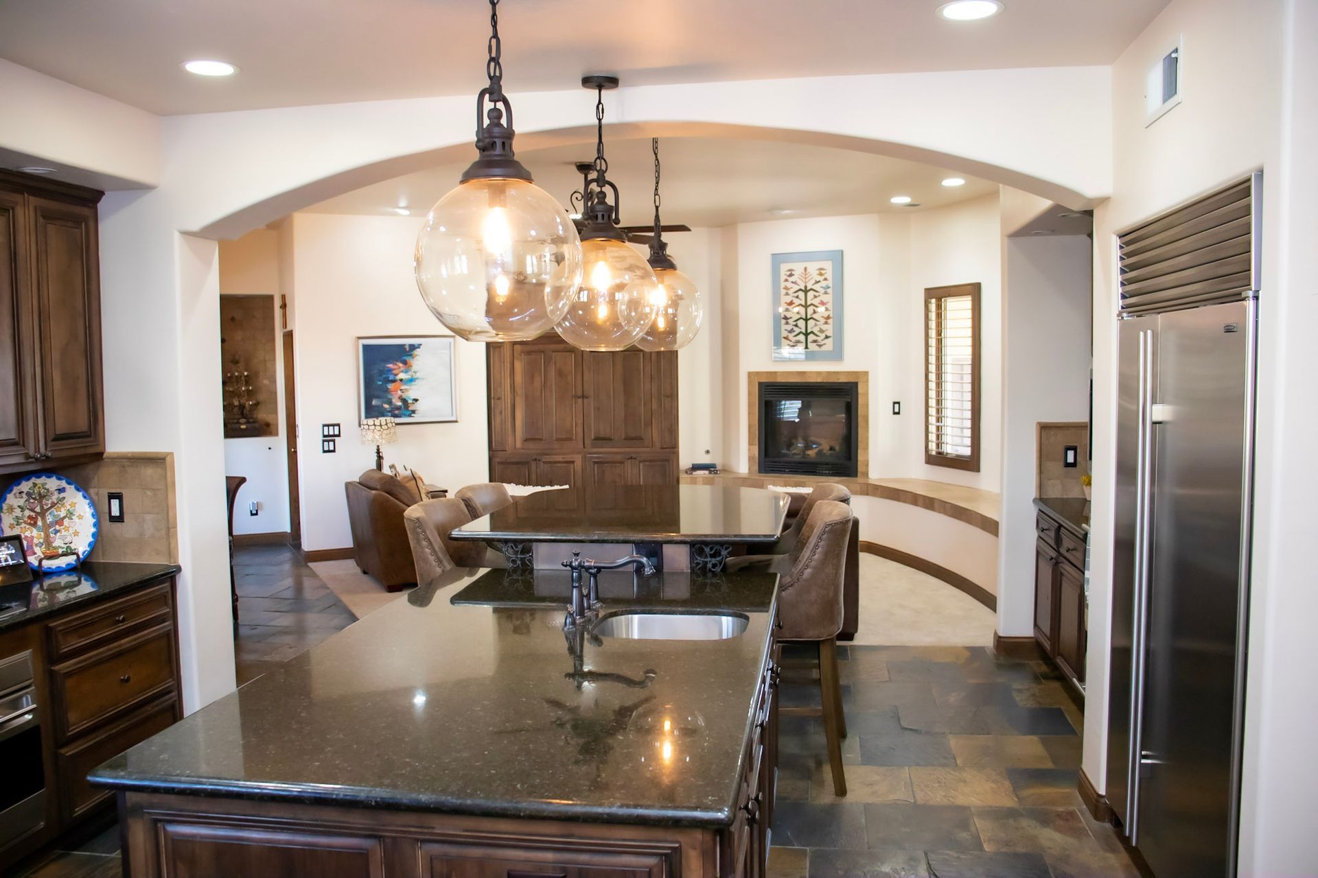 a kitchen with stainless steel appliances and a stainless steel refrigerator