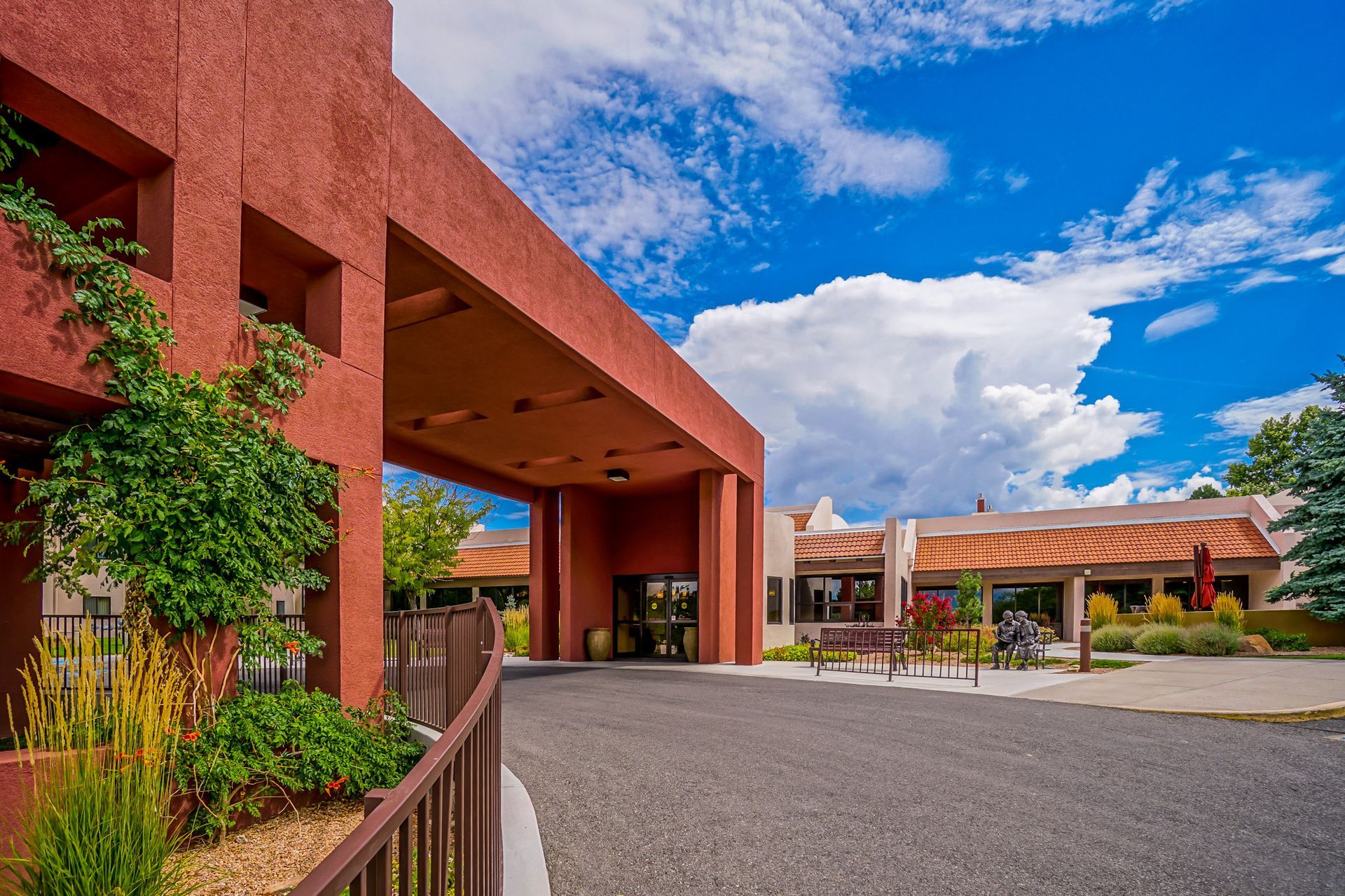 a large red building with a driveway leading to it .