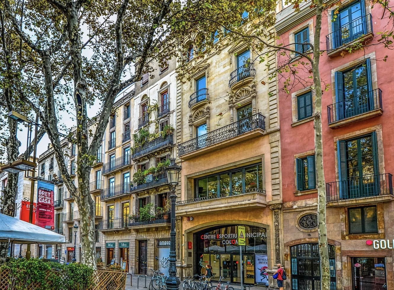 The colourful streets of Barcelona with pretty town house terraces.