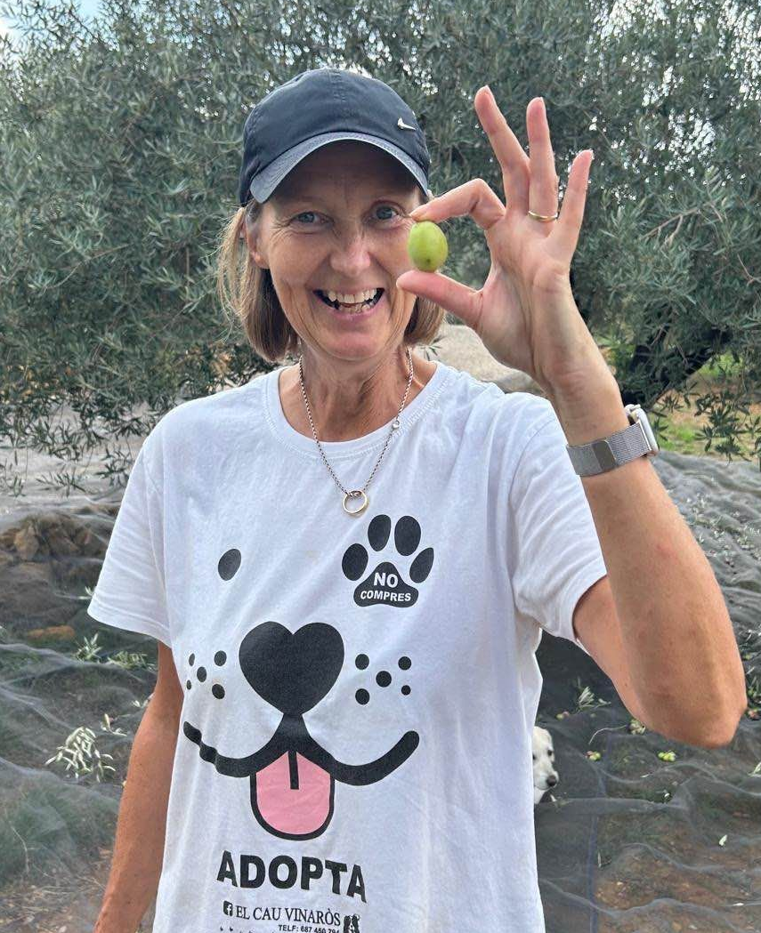 Claire Bretten with a very large olive discovered during the olive harvest at Casa de Olivos near Vinaros