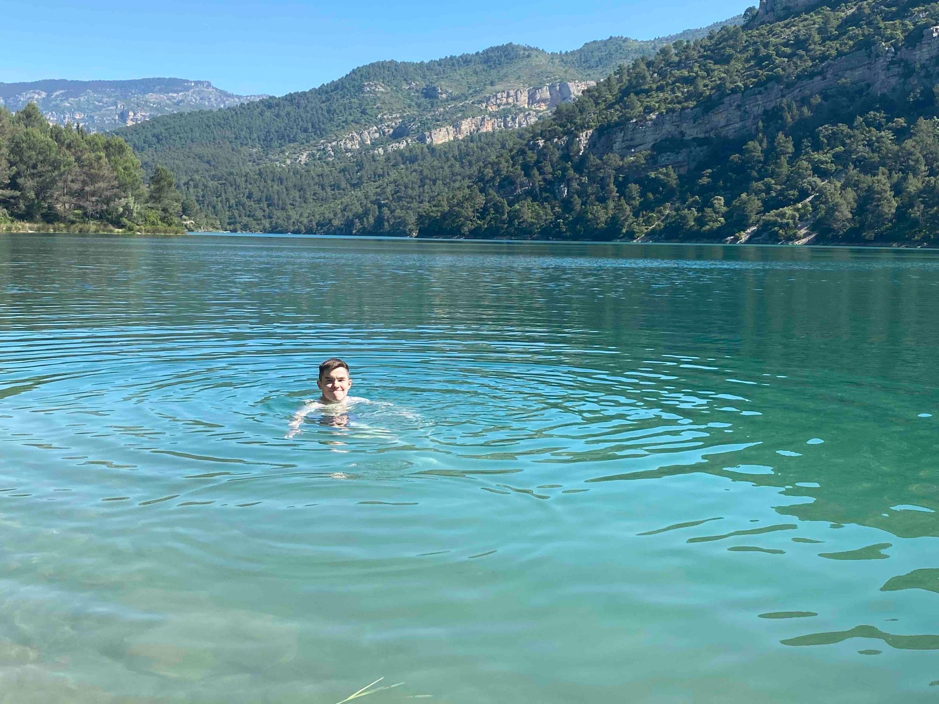 Man swimming in the Ulldecona reservoir near Casa de Olivos