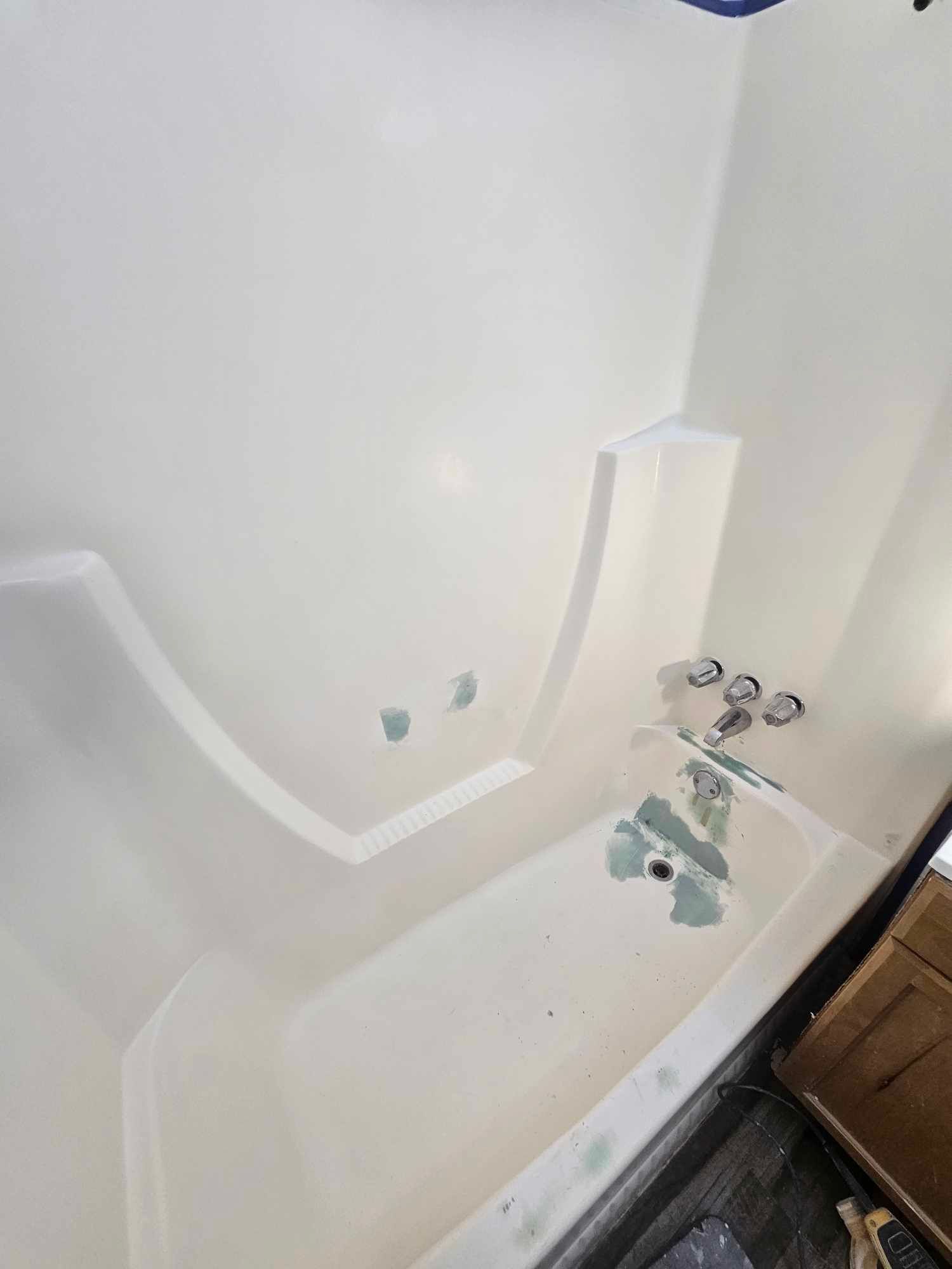 Image of a bathtub under going reglazing.