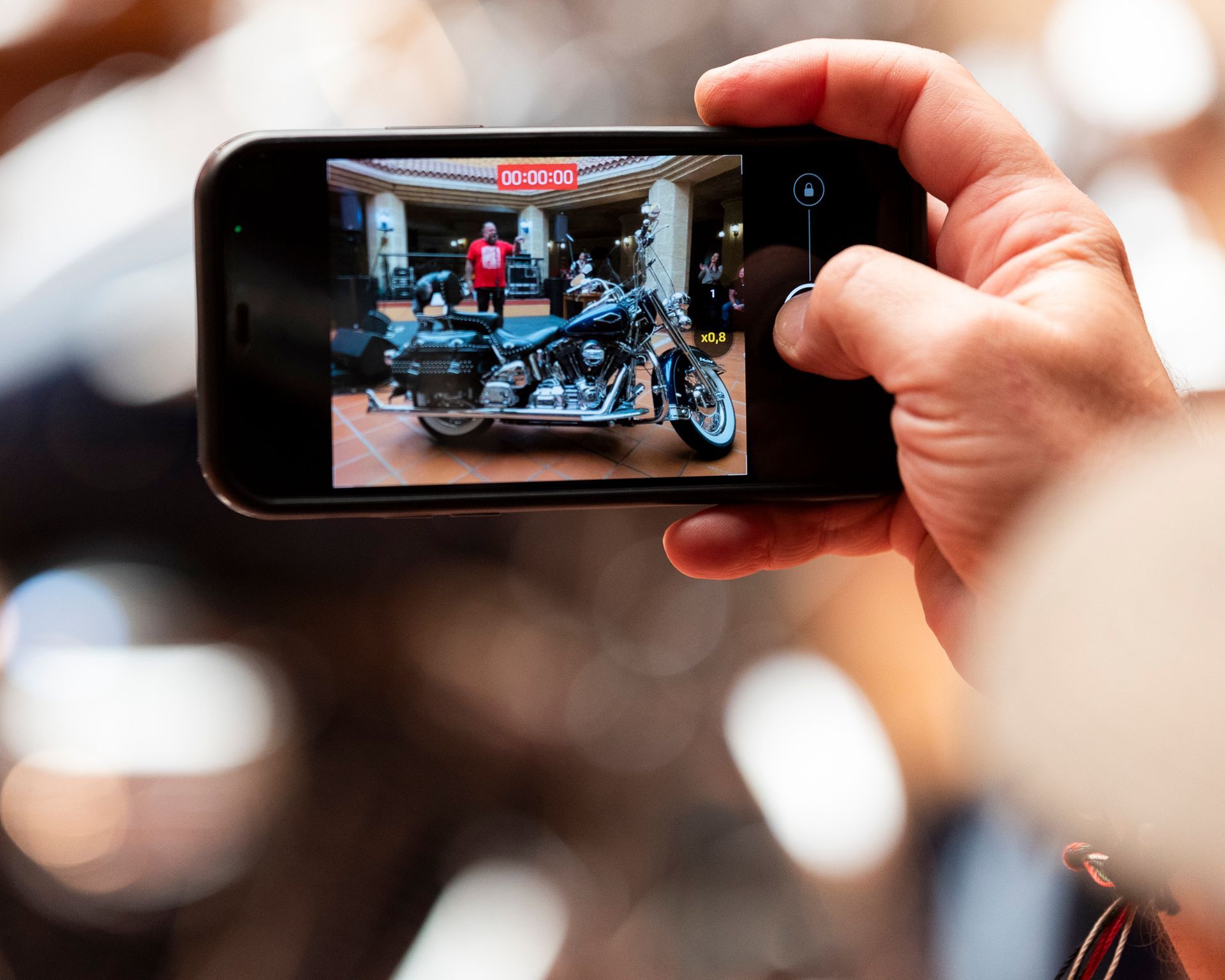 A person is taking a picture of a harley davidson motorcycle