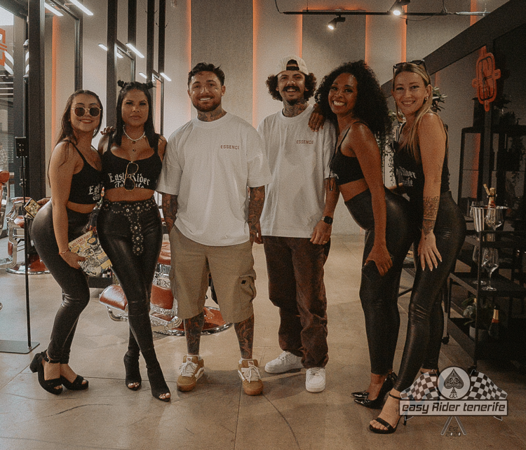 A group of people are posing for a picture in a room.