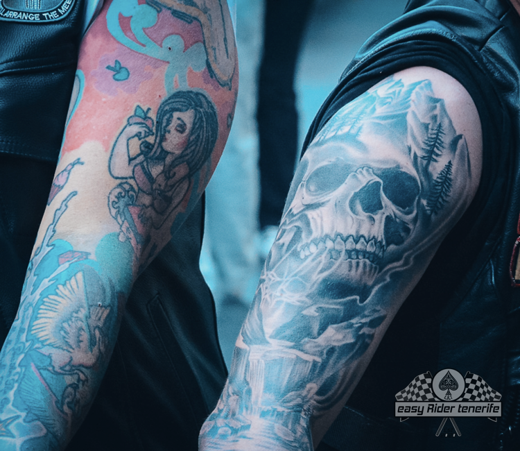 A man has a tattoo of a skull on his arm