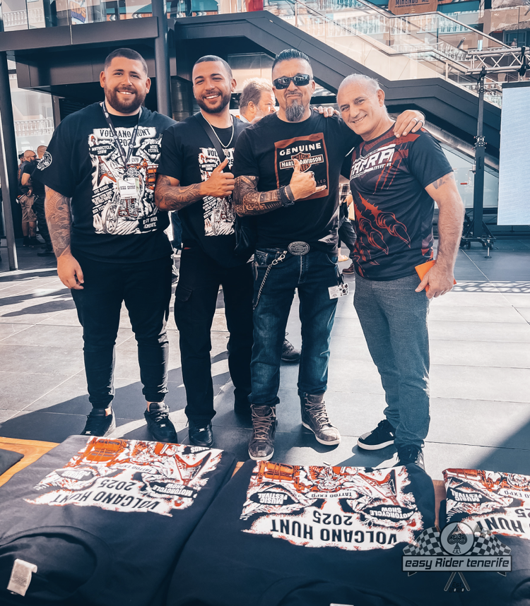 A group of men are posing for a picture while wearing shirts that say volcano hunt