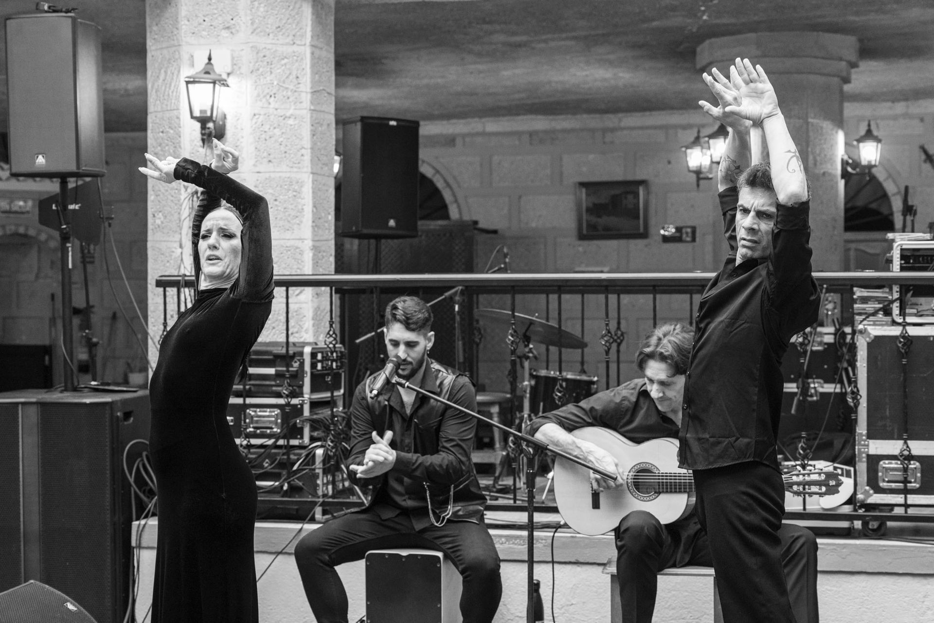 A black and white photo of a group of people playing instruments
