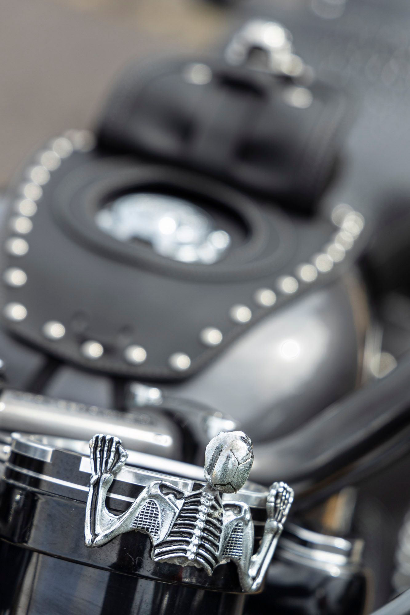 A close up of a skeleton on a motorcycle