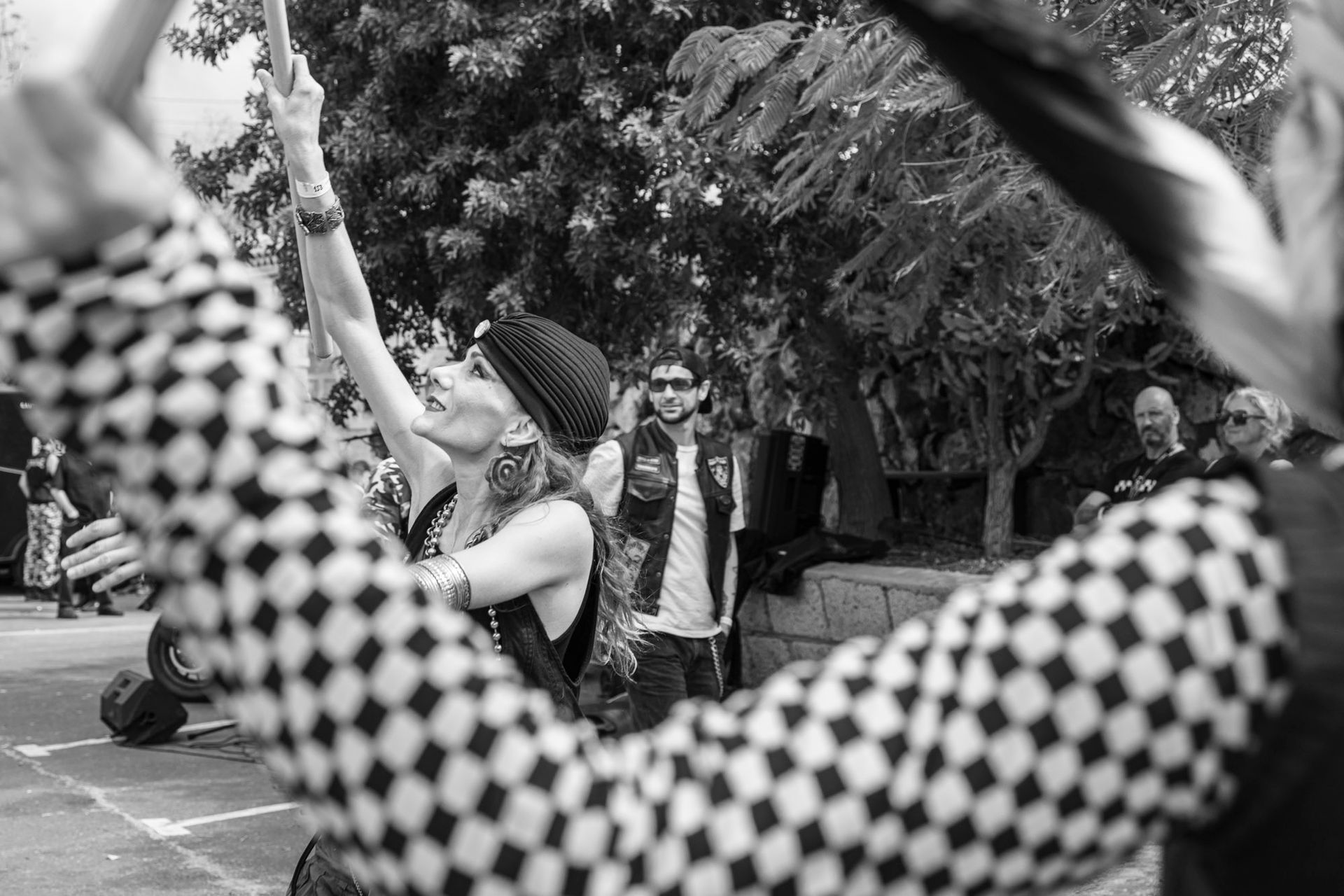 A black and white photo of a group of people taking a picture of themselves.