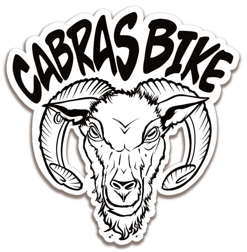 A black and white drawing of a goat 's head with the words cabras bike below it.