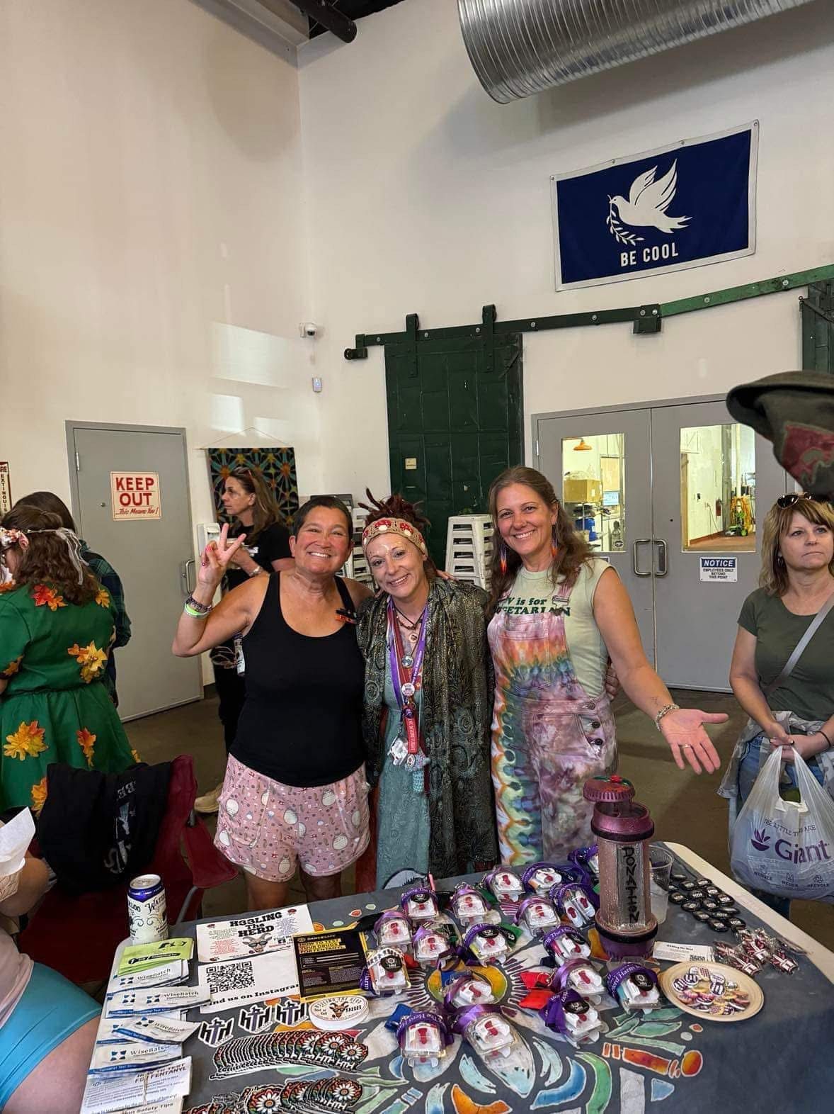 A group of women are posing for a picture in a room.