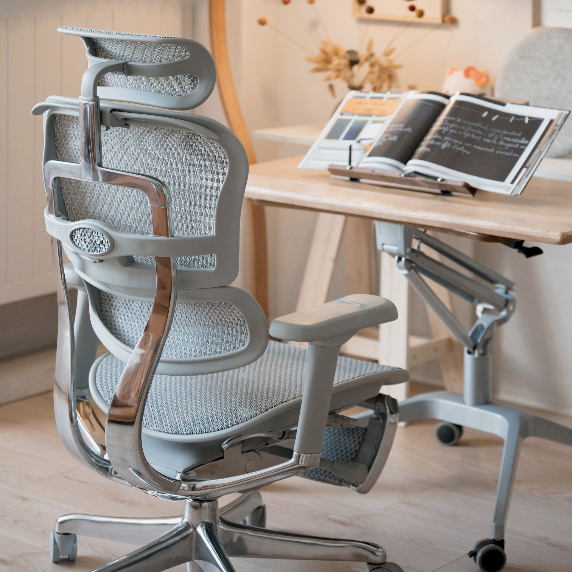 grey ergohuman office chair at a desk