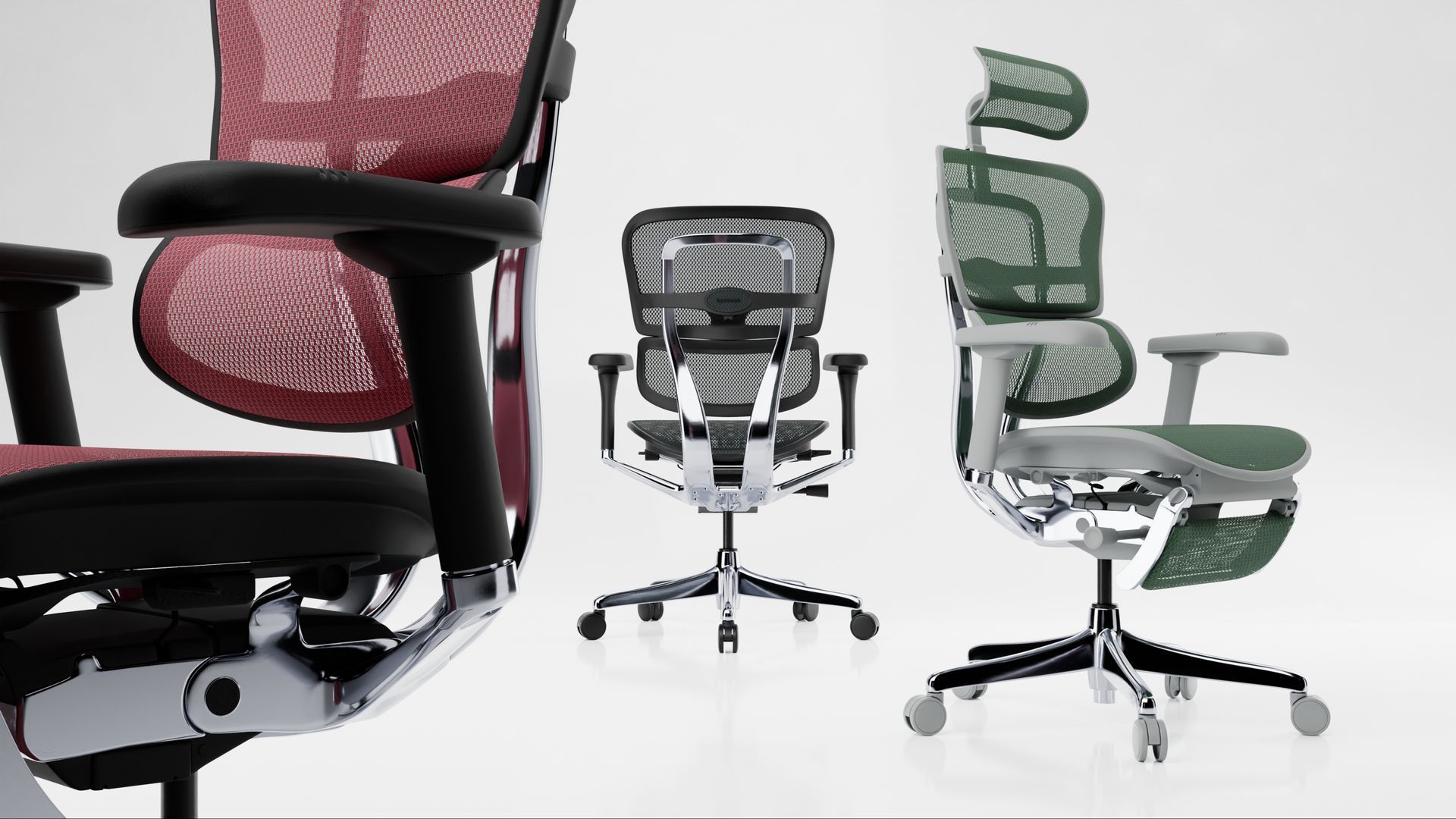 3 Ergohuman Elite office chairs in a white space. The left chair is black frame with scarlet mesh. The middle chair, facing the back, is black frame black mesh. The chair on the right is grey frame with green mesh. 