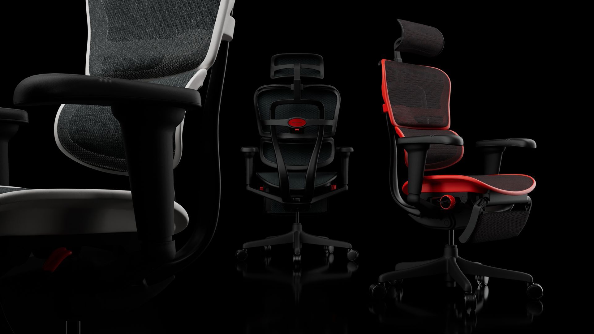 three Ergohuman Ultra gaming chairs with white, black and red frames. the black is in the middle, showcasing the rear view. the red is to the right, angled 45-degree forward to the right. the white is at the left, facing 45-degrees to the left