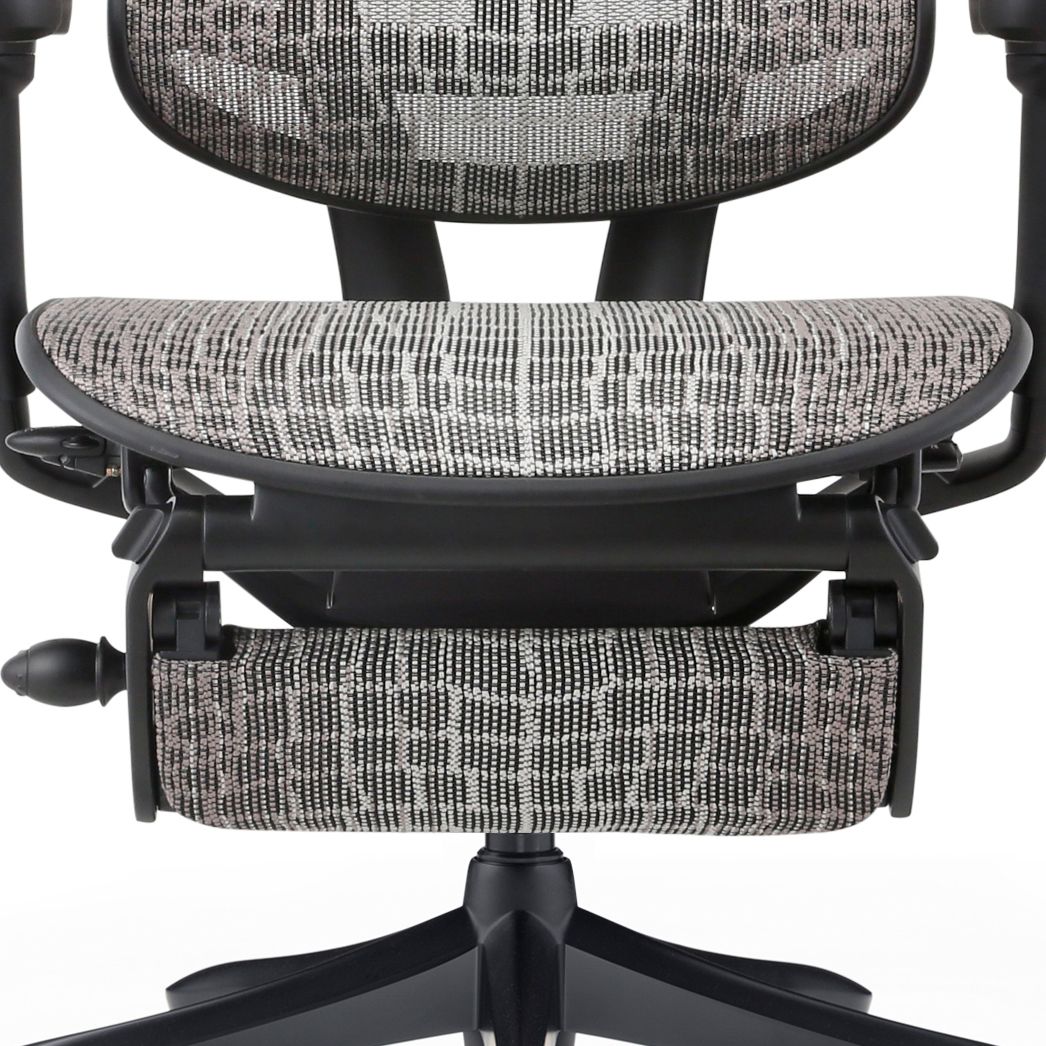 Front view of the lower half of the chair, showing the waterfall seat front and adjustable legrest.