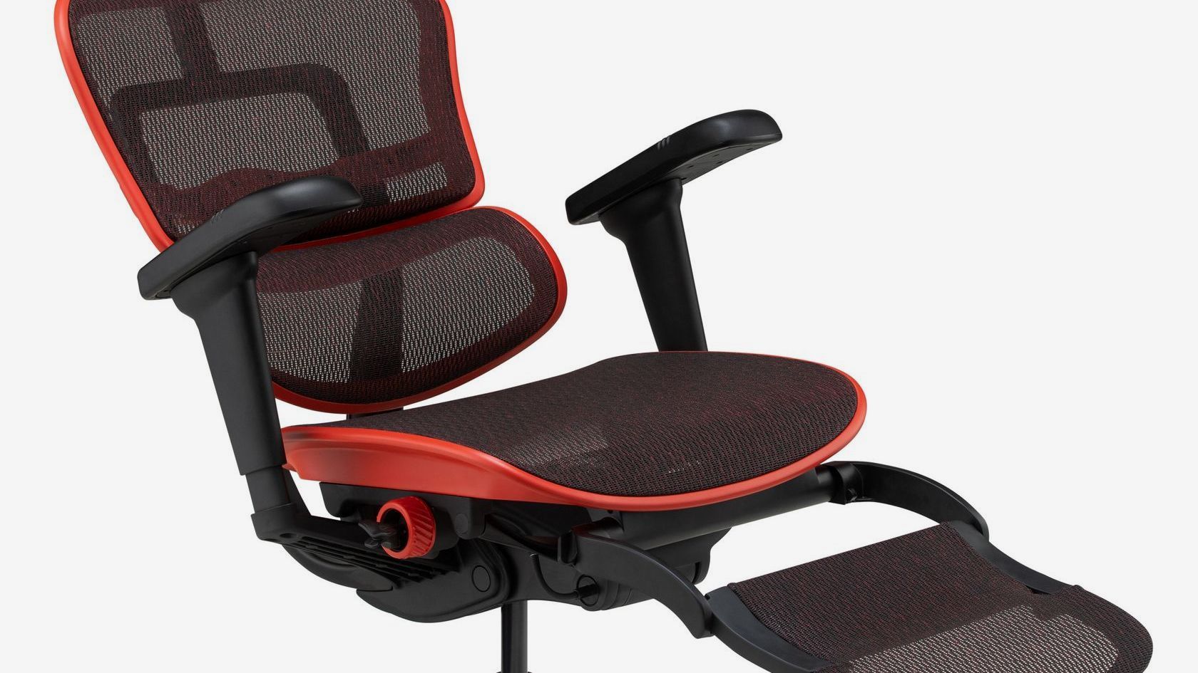 Ergohuman Ultra in a red frame with black mesh against a white background. The chair is slightly tilted back with the footrest up. 