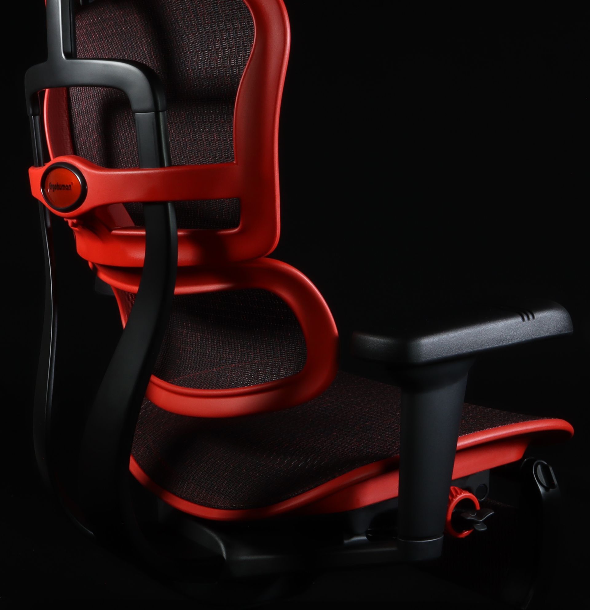 Back view of the Ergohuman Ultra gaming chair, showcasing the red frame and black mesh.